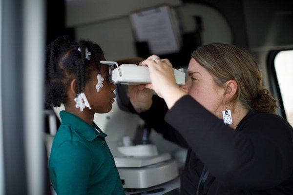 A person checking her eyesight AI-generated content may be incorrect.