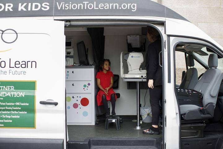 A child sitting in a van AI-generated content may be incorrect.