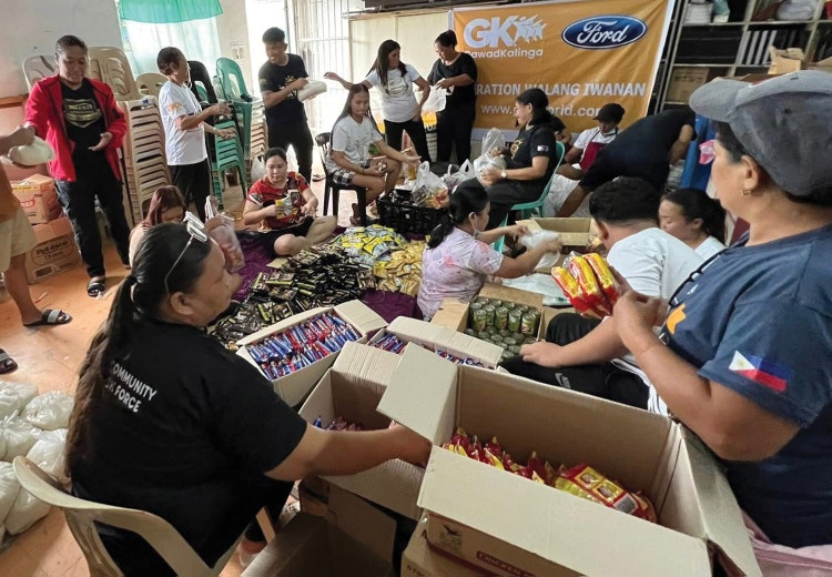Volunteers hard at work boxing materials