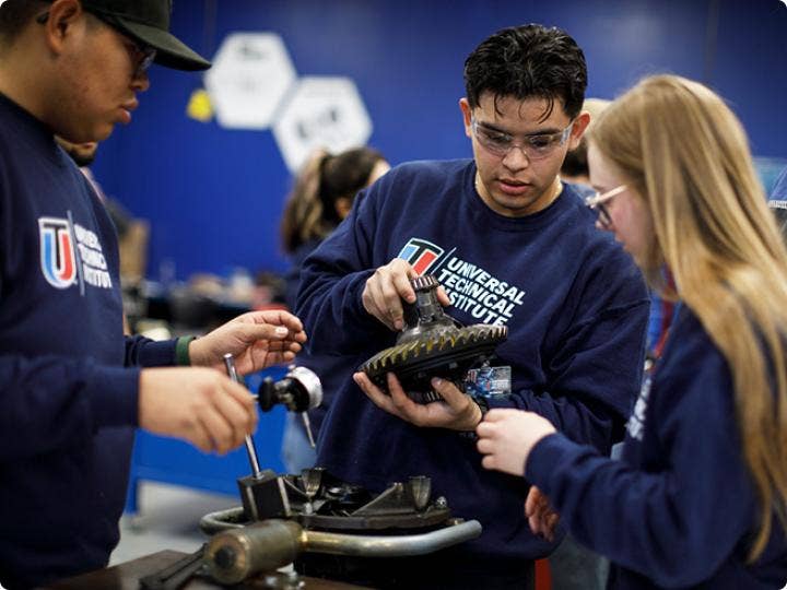 A group of people working on a machine AI-generated content may be incorrect.