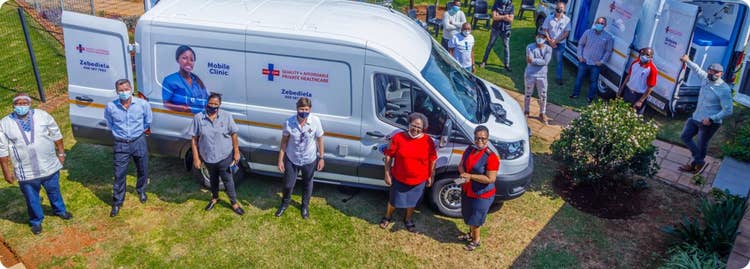 A group of people standing next to a van AI-generated content may be incorrect.