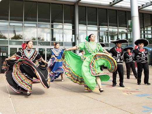 A group of people wearing traditional clothing AI-generated content may be incorrect.