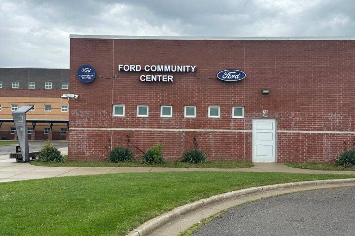 A building with a sign on the side AI-generated content may be incorrect.